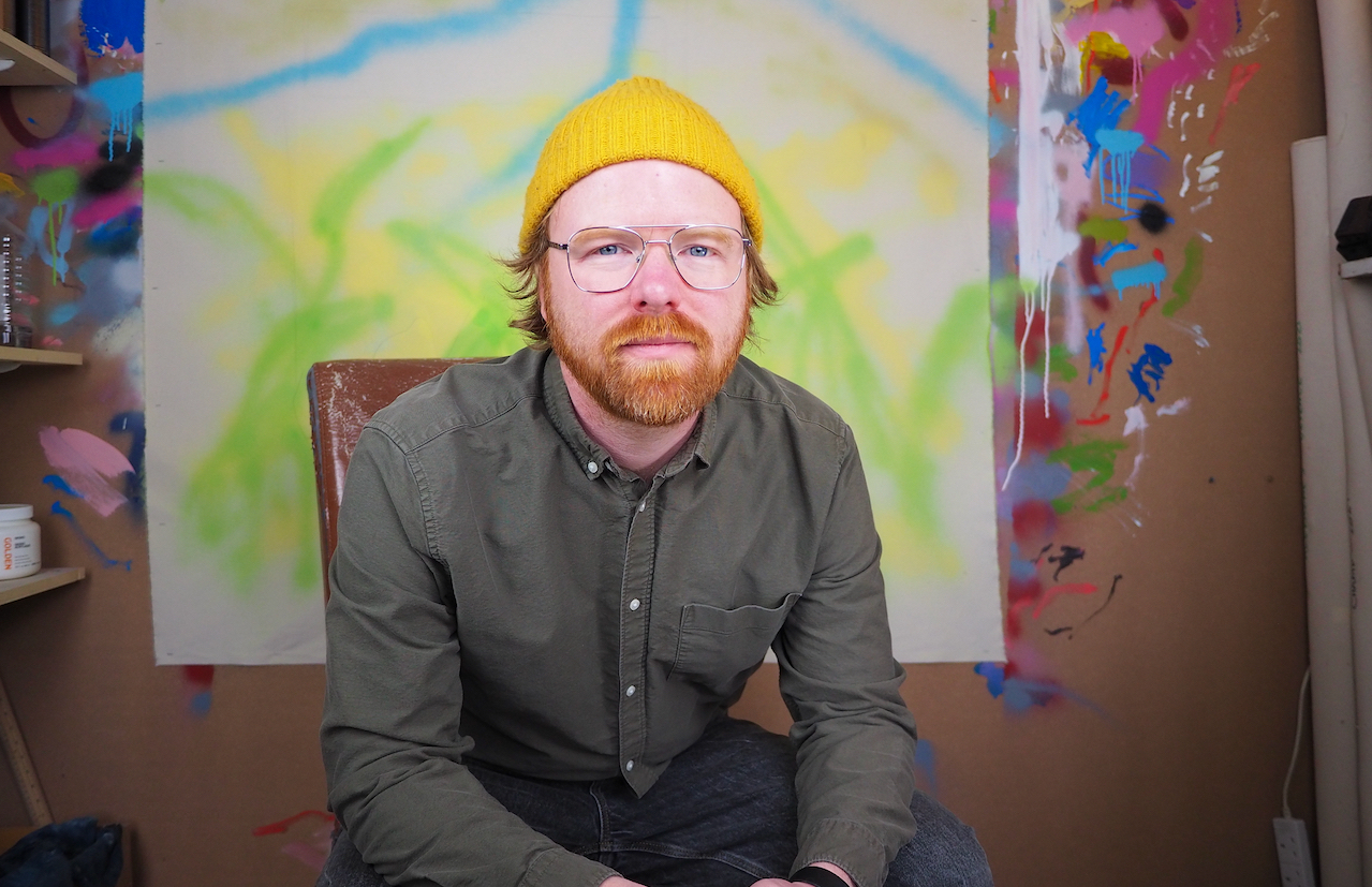 A portrait of Adam Forsythe in his studio.